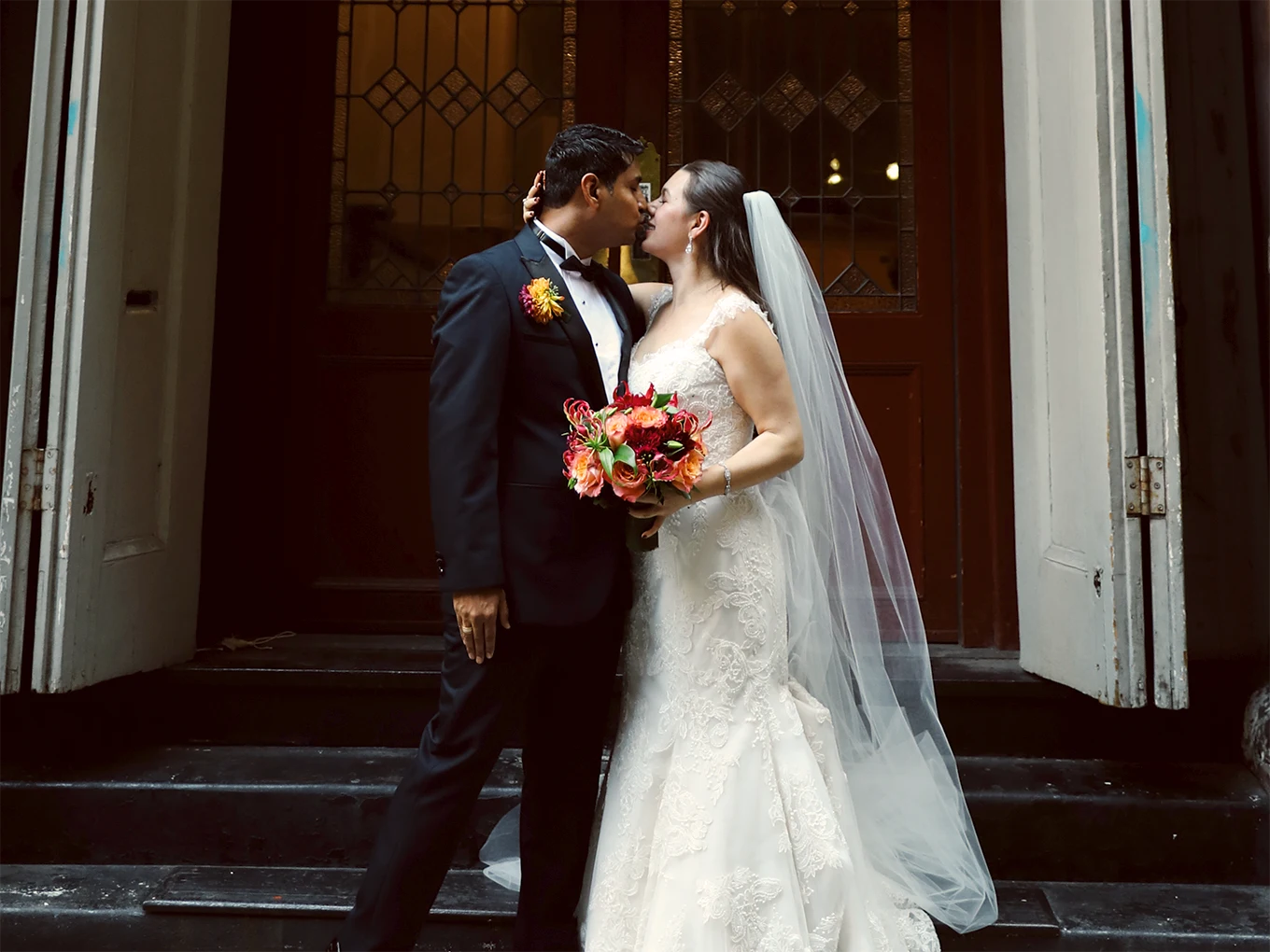 Photo of married couple in front of church